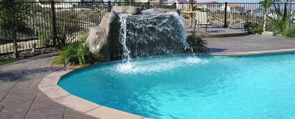 Swimming pool and spa with a smooth light blue plaster interior