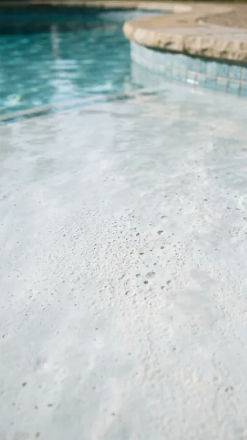 Close-up of a smooth cement pool plaster surface